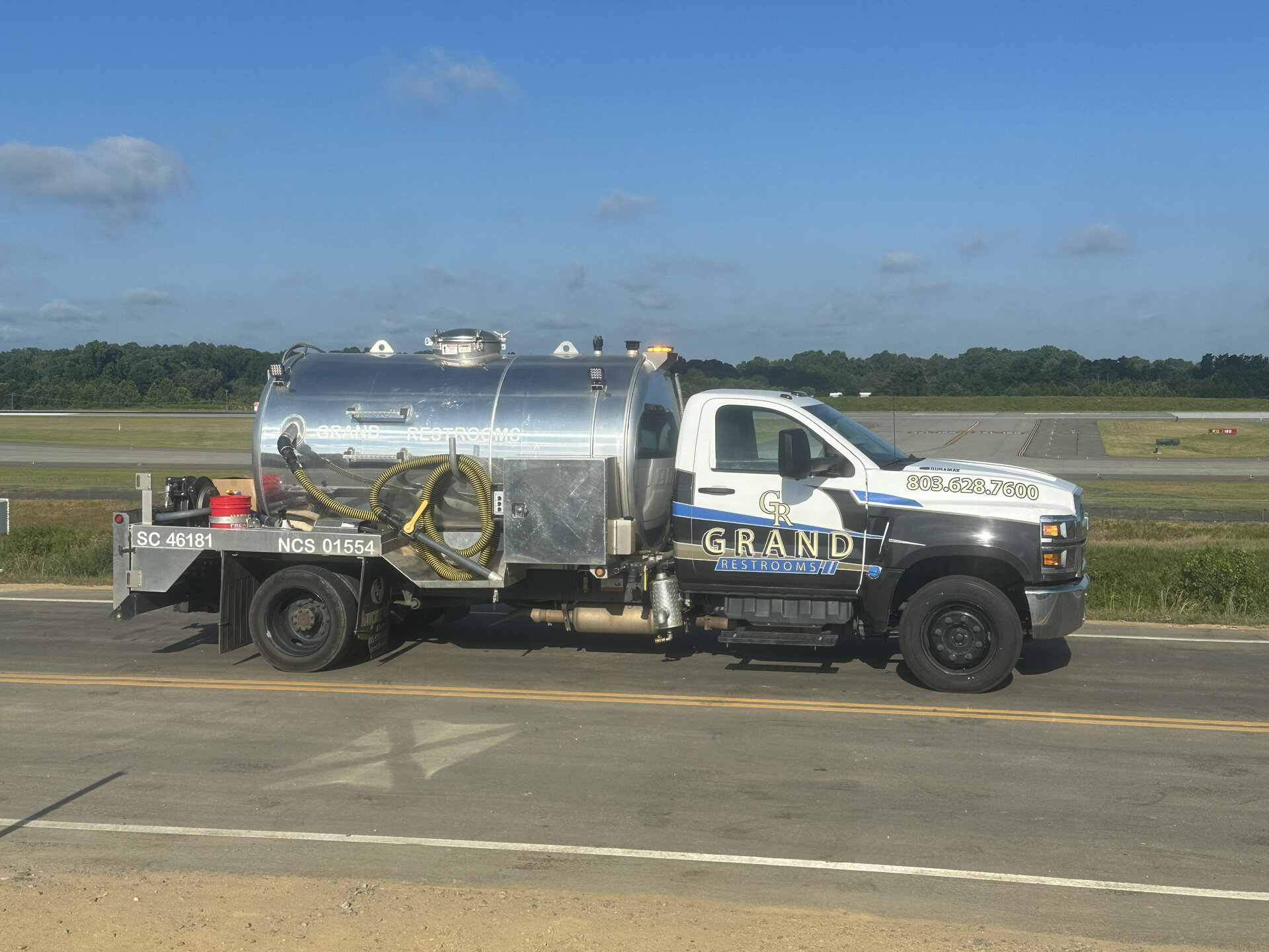 Grand Restrooms delivery fleet multiple vehicles event transporting luxury restroom trailers across the Carolinas