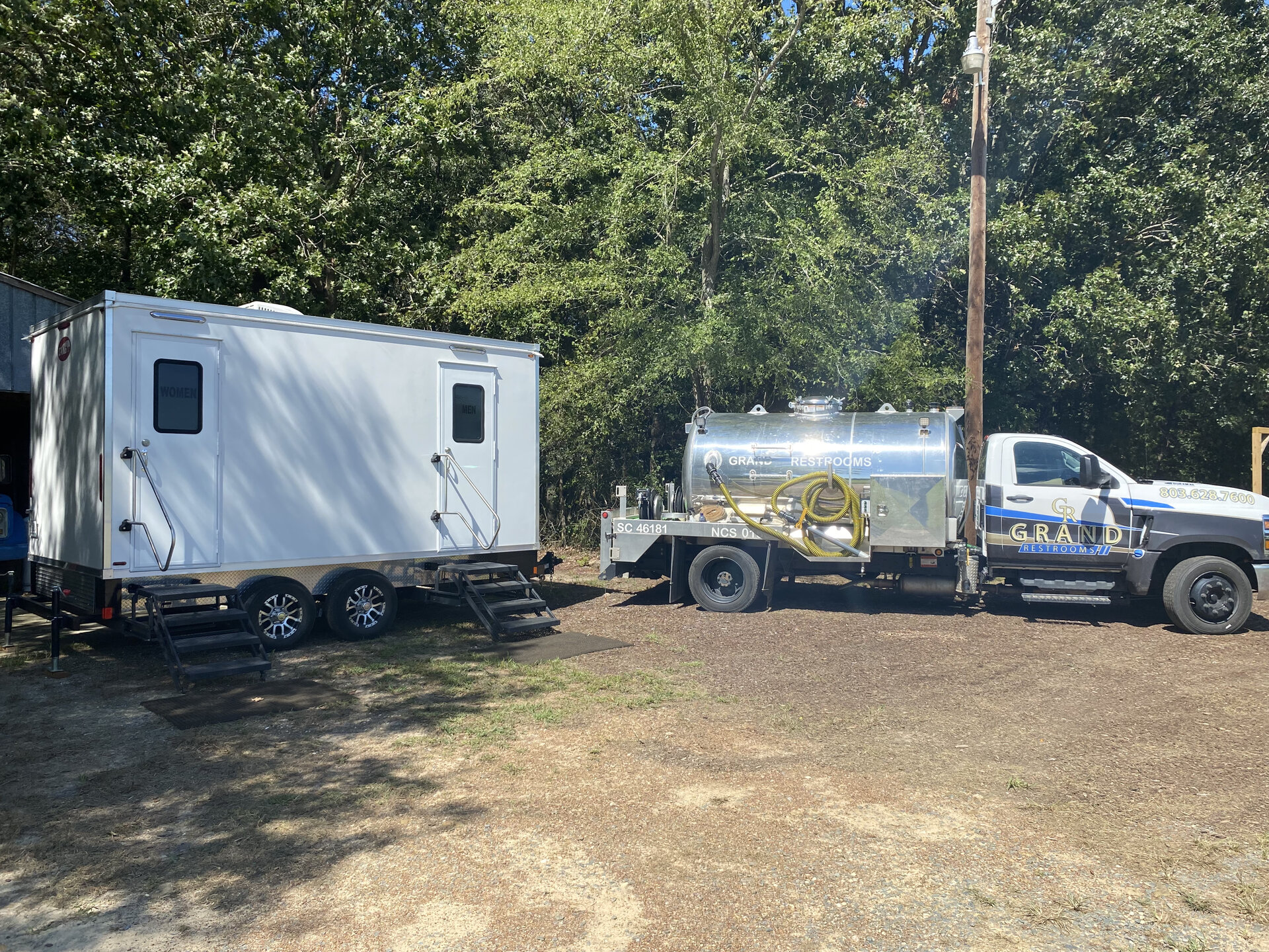 Grand Restrooms delivery fleet service setup trailer pump truck transporting luxury restroom trailers across the Carolinas