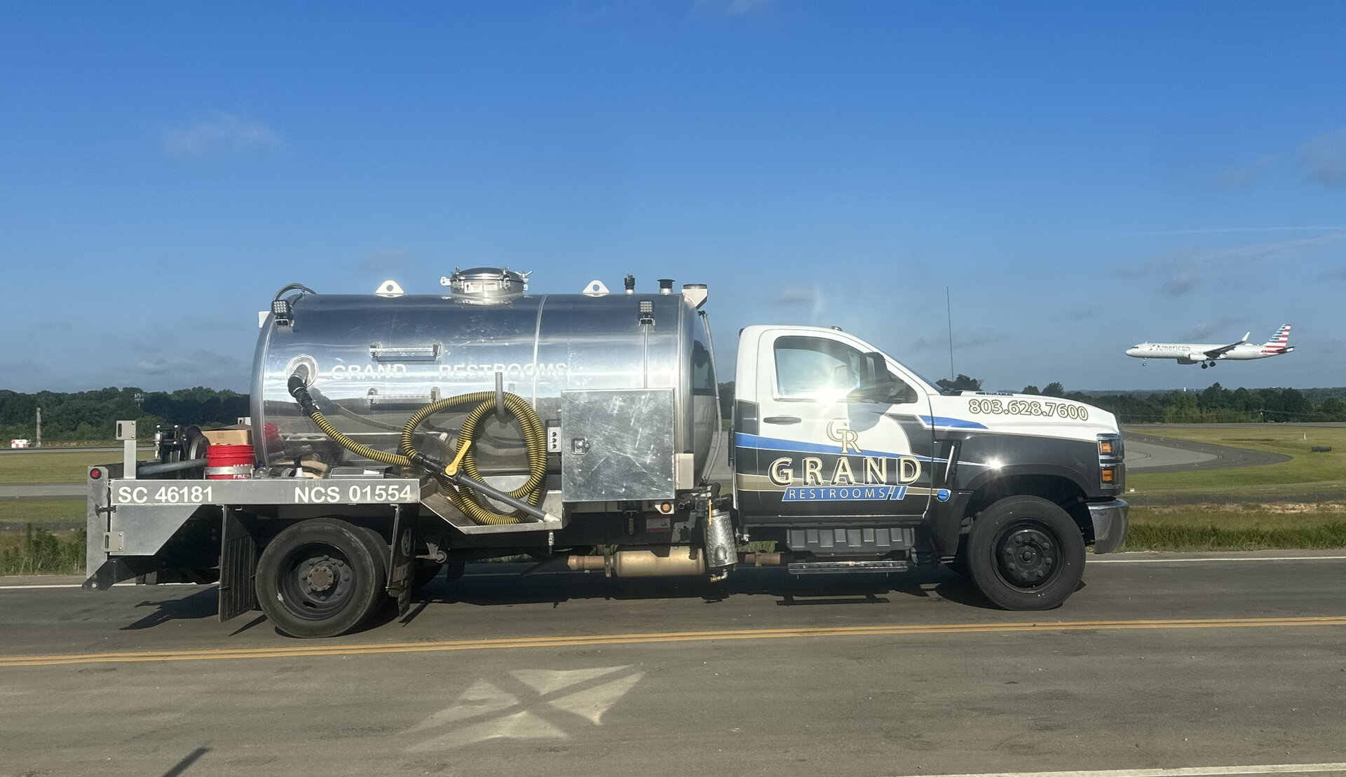 Grand Restrooms delivery fleet service vehicles lined up transporting luxury restroom trailers across the Carolinas