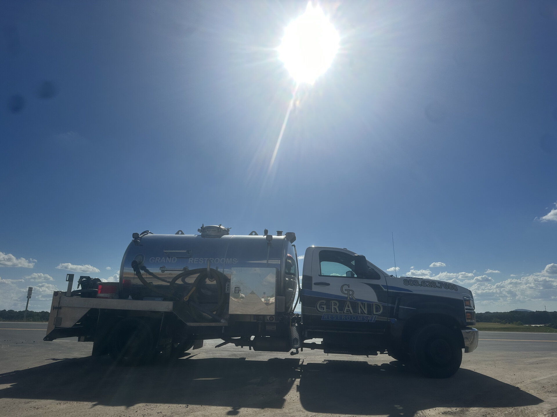 Grand Restrooms delivery fleet trailer setup transporting luxury restroom trailers across the Carolinas