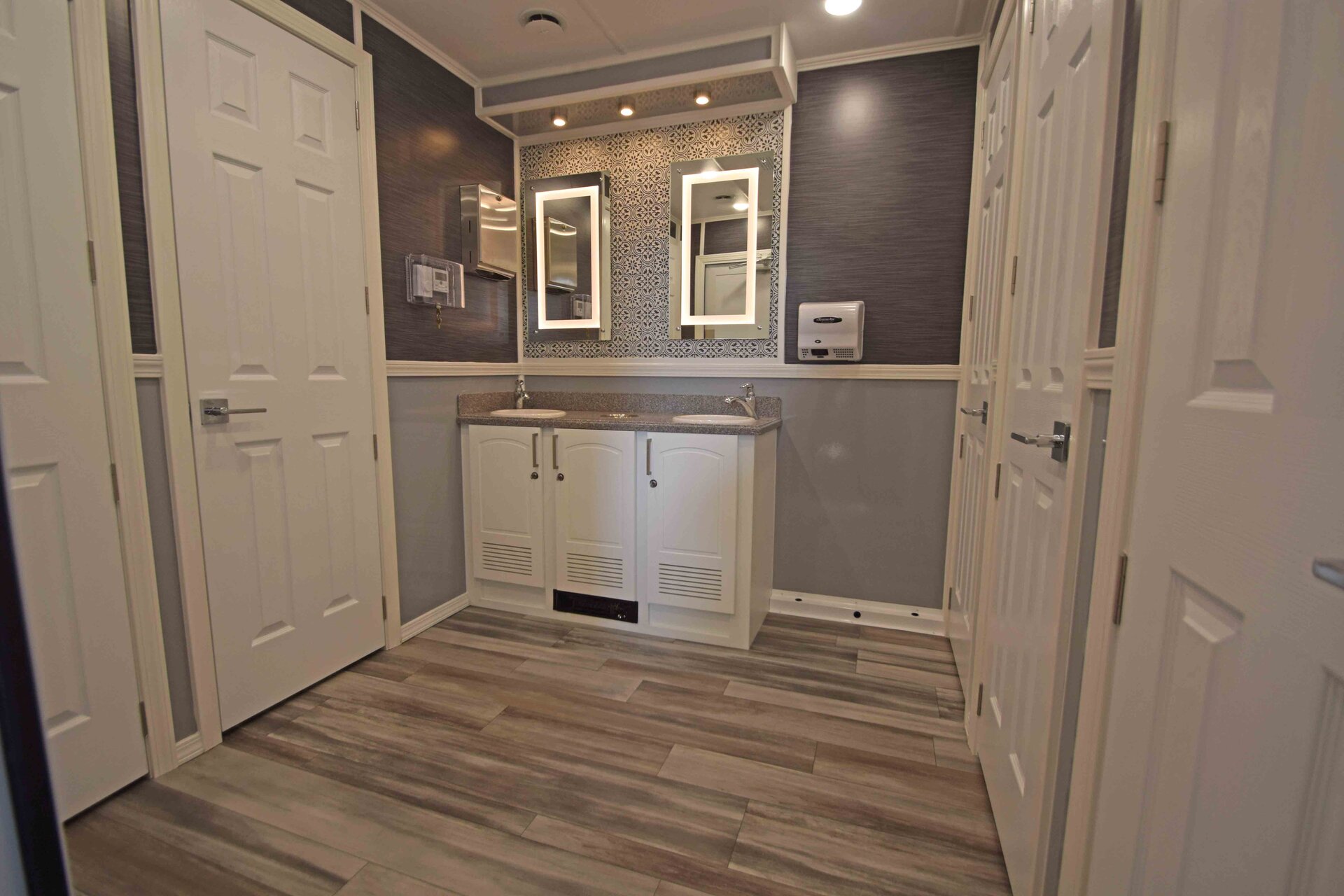 Women's side of the 9 station luxury restroom trailer with decorative lighting