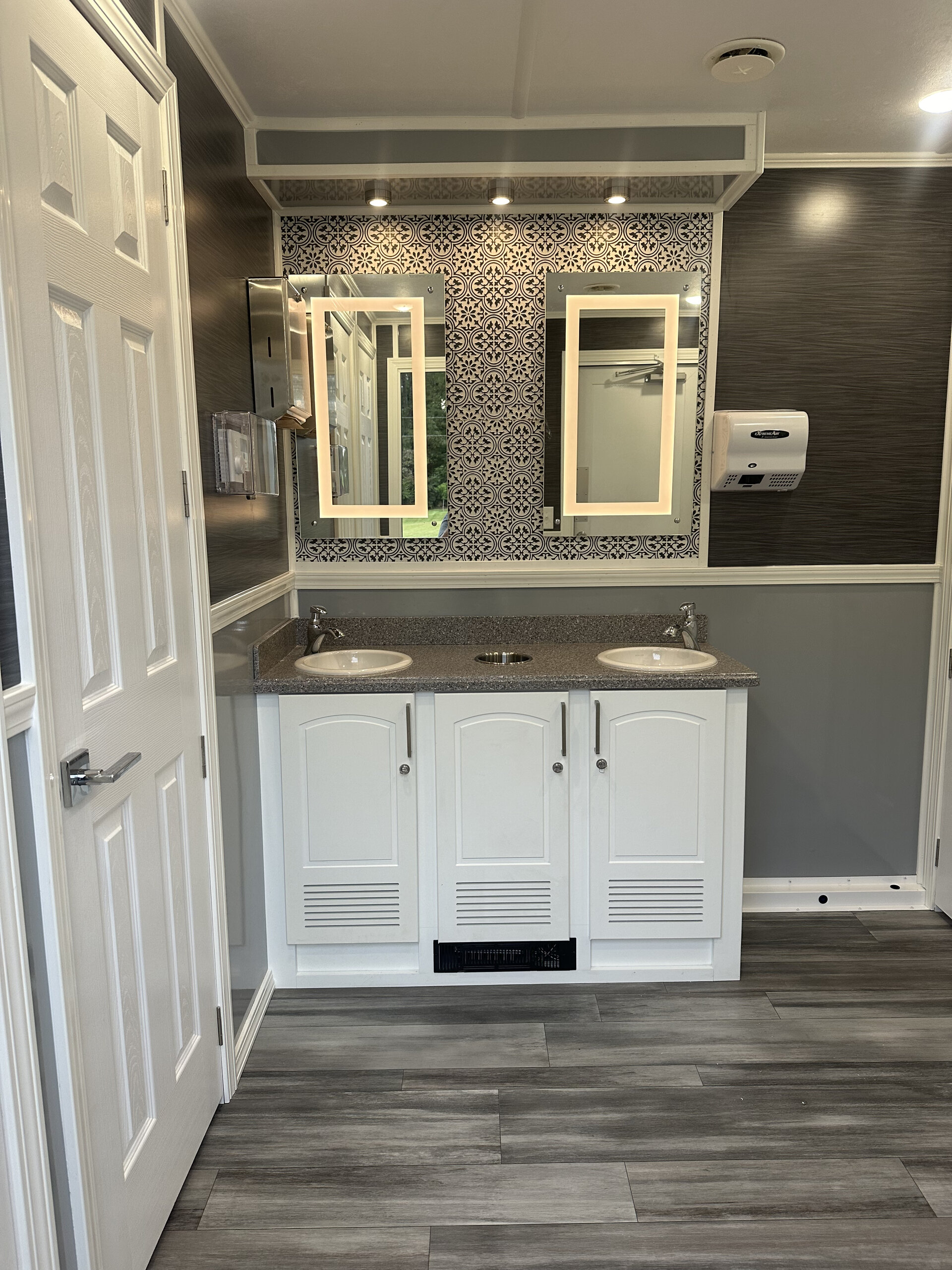 Luxury restroom interior full view stalls providing climate-controlled hospitality for Carolina events