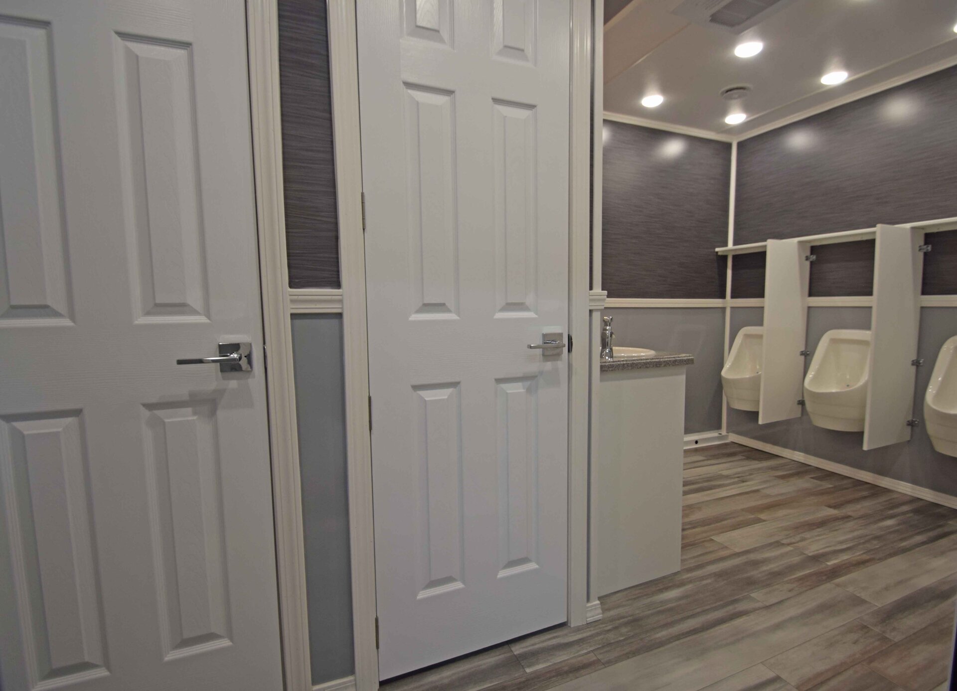 Men's suite of the 9 station luxury restroom trailer with urinals