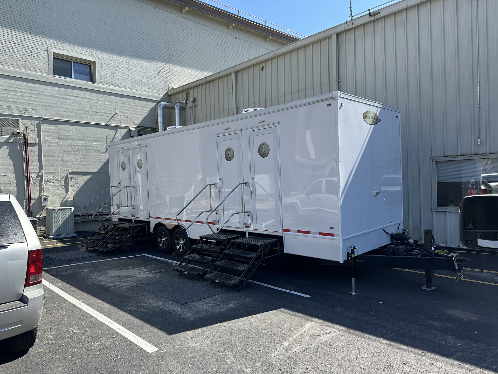 Luxury restroom interior stall layout providing climate-controlled hospitality for Carolina events