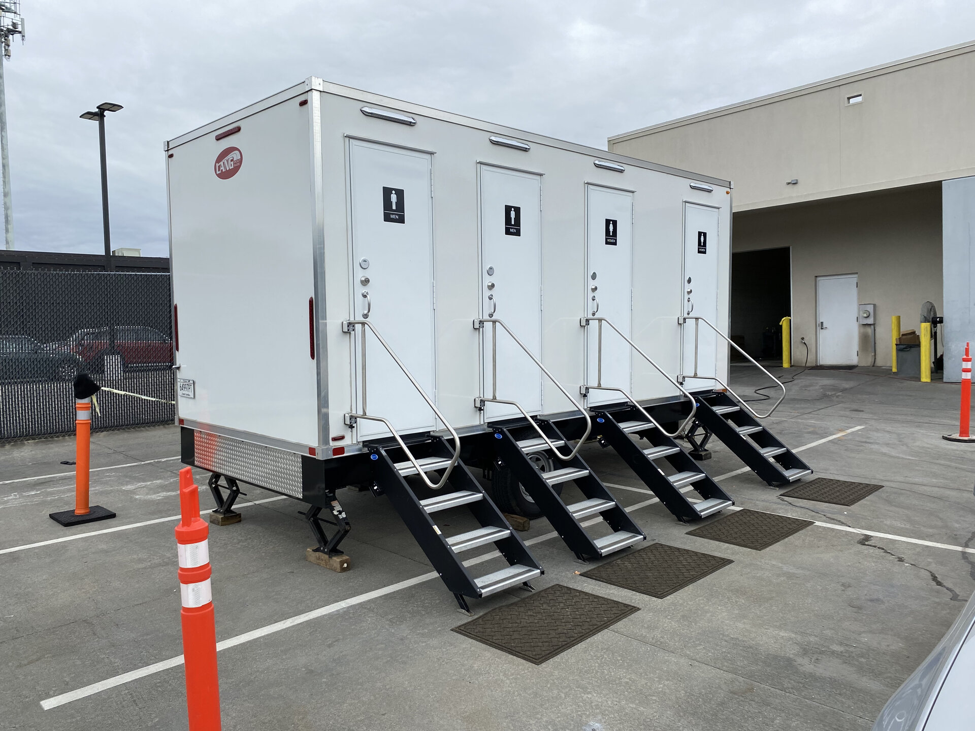 Multiple portable restrooms arranged for heavy usage with frequent service