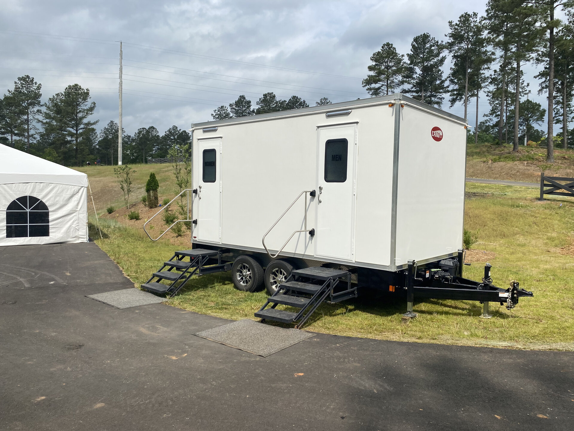 Portable restroom unit s venue lighting maintained by Grand Restrooms for Carolina construction sites and festivals