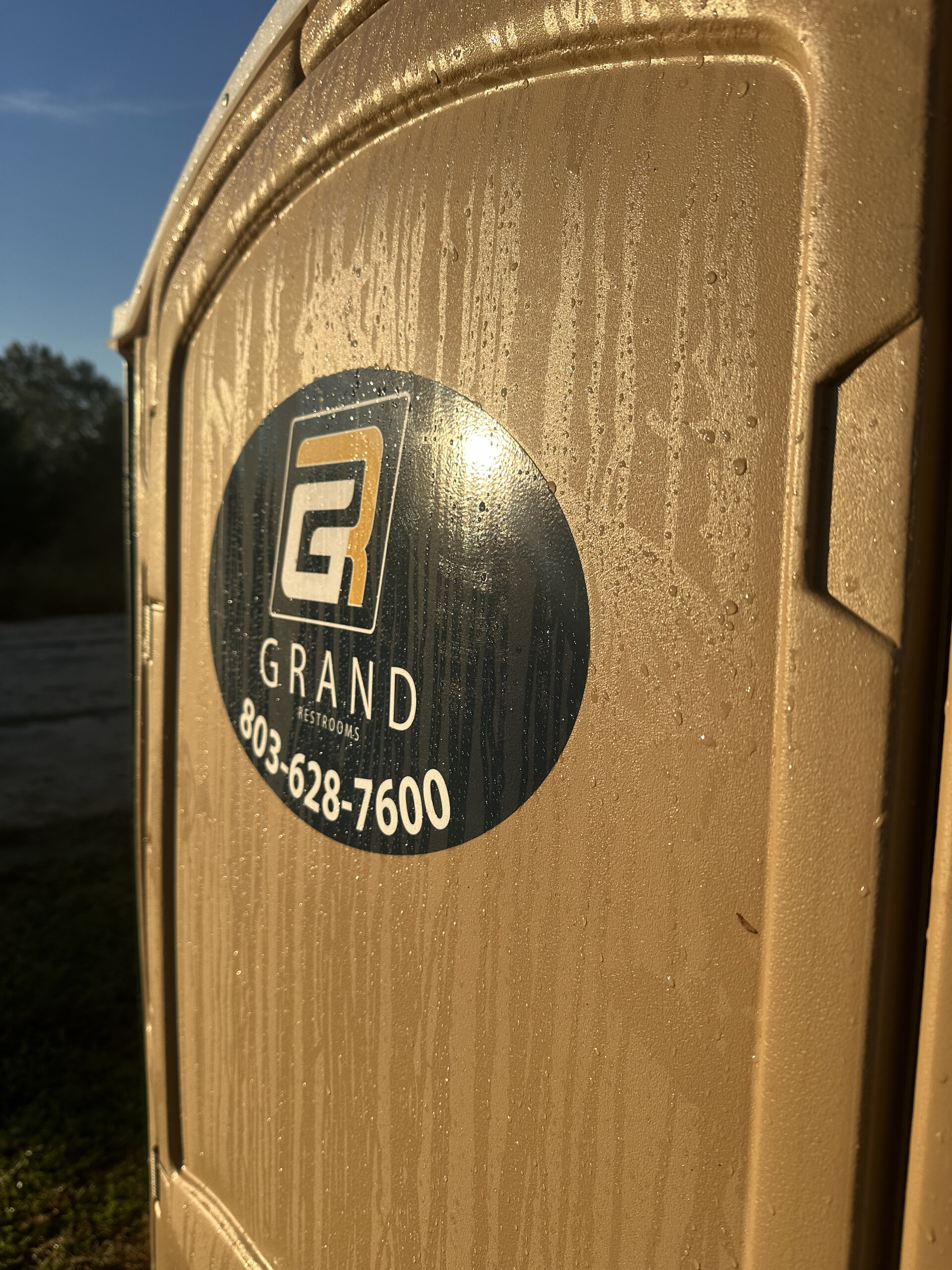 Grand Restrooms service team 3 members with equipment delivering concierge restroom experiences across the Carolinas